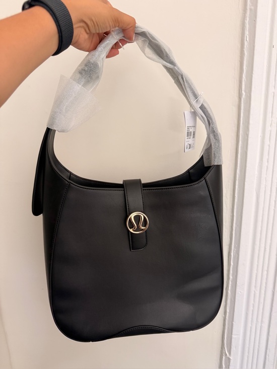 lululemon athletica Handbags - lululemon athletica Black Shoulder Bag with Gold Logo Accent